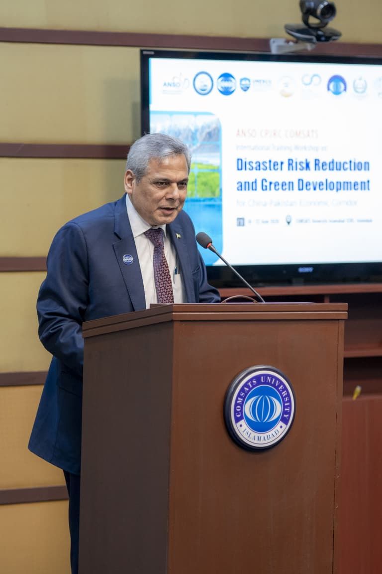 Ambassador Dr. Mohammad Nafees Zakaria speaking at a COMSATS climate and disaster risk reduction activity